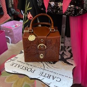 Patricia nash tooled leather purse used one time, it’s a beautiful purse.